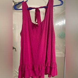 Large, bright top from a local boutique. Worn once.